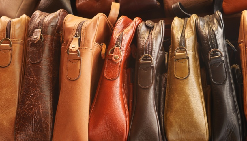 Close up of leather handmade bags on a wall for sale