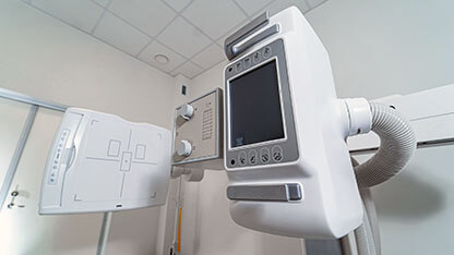Close up of radiology diagnostic machine in hospital. Modern x-ray equipment with digital display and control system in clinic.