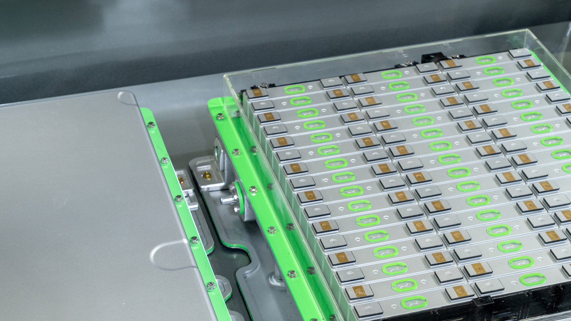 A machine featuring green and white components, showcasing a modern design and industrial functionality.