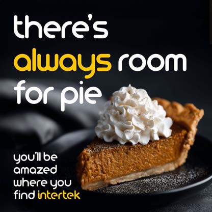 A slice of pumpkin pie with whipped cream on a plate