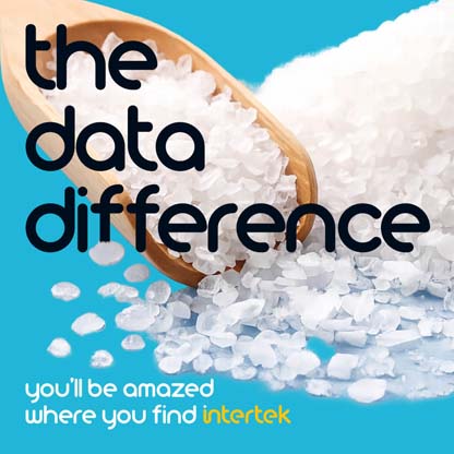 A pile of white crystals picked up by a wooden spoon